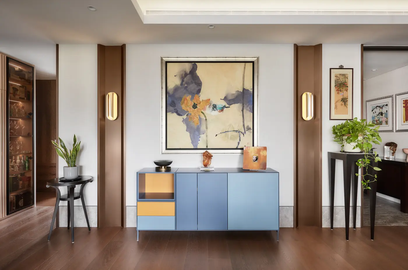 Foyer with Feng Shao Hua painting and blue-yellow Treku sideboard