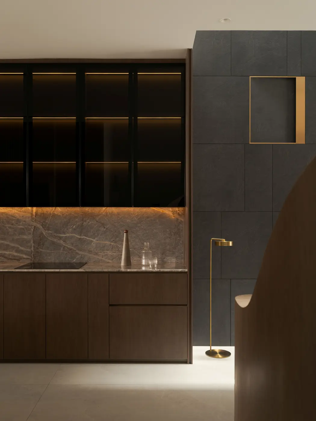 Dry kitchen — dark smoked-glass upper cabinets with amber underlighting