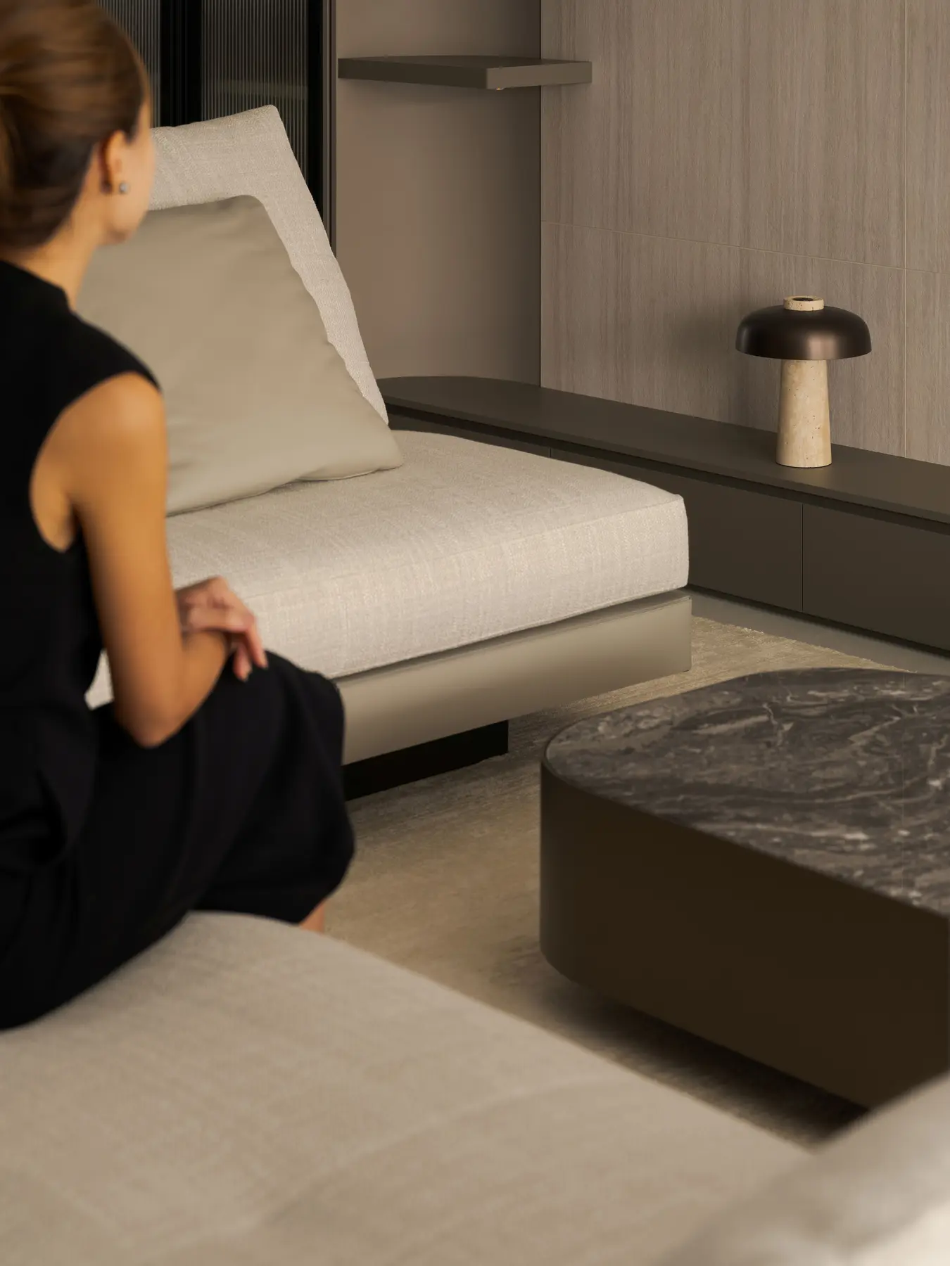 Living room — resident at rest in the sofa lounge, space held in stillness