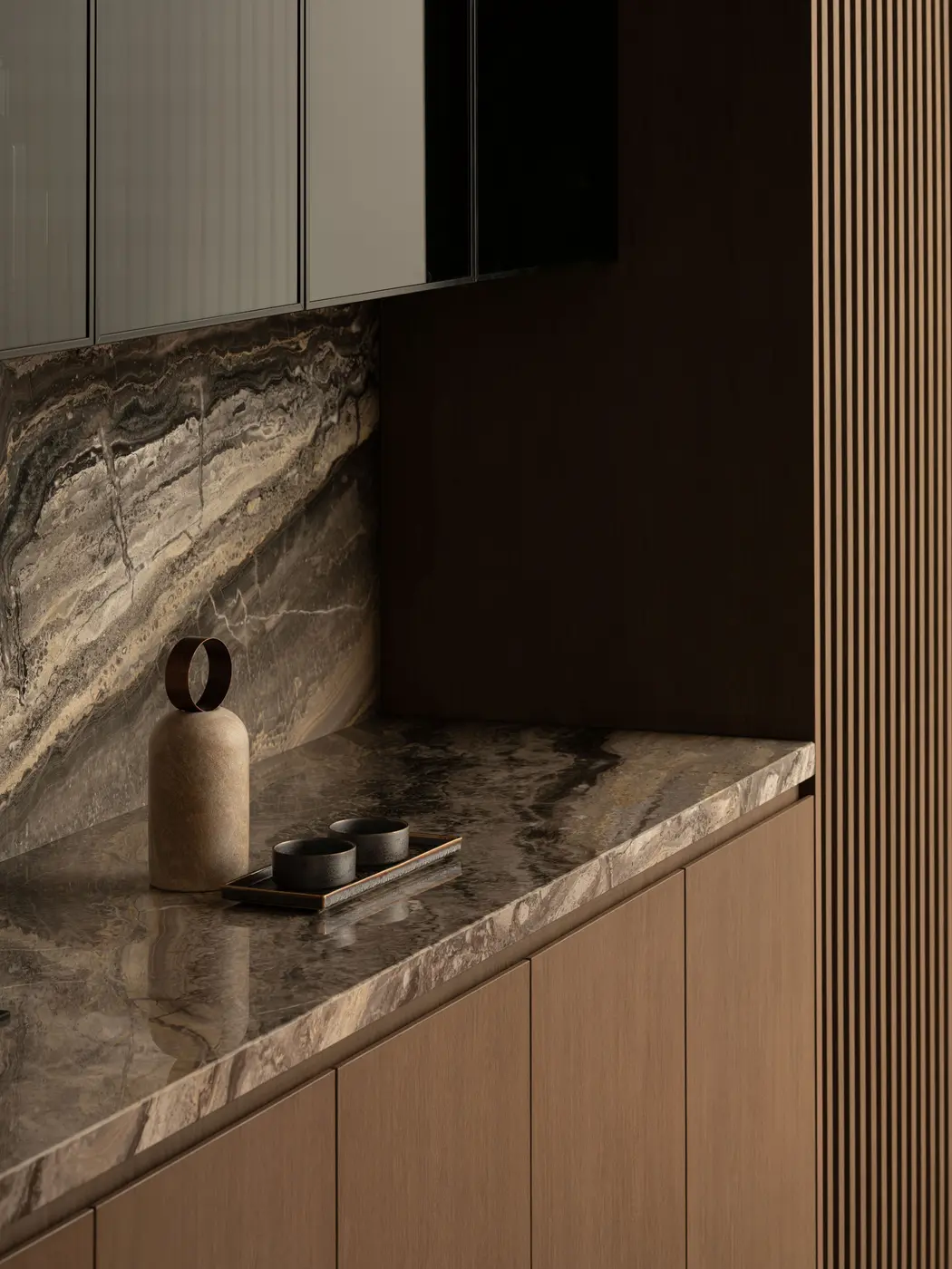 Kitchen counter detail — richly veined marble backsplash in deep amber tones