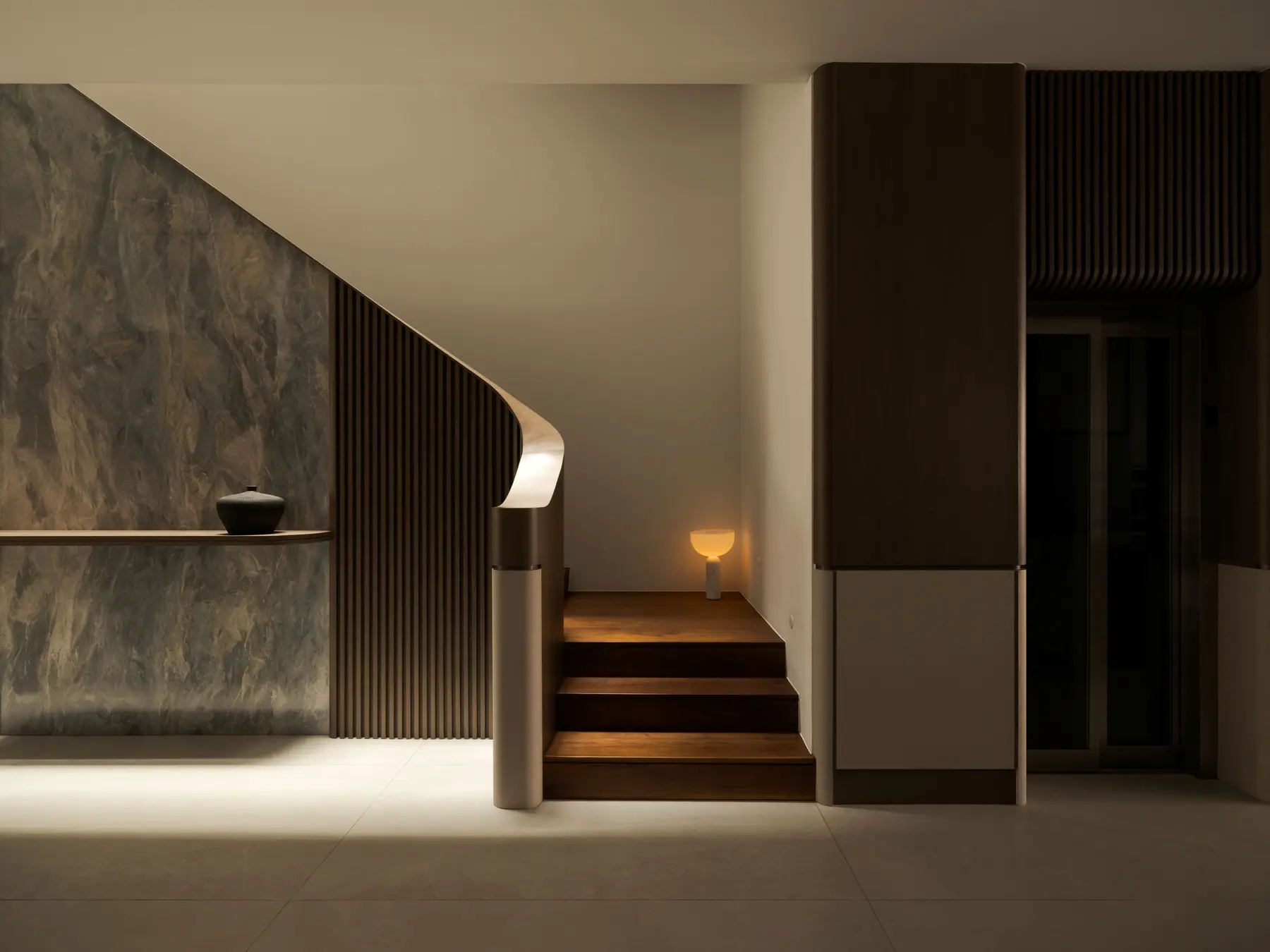 Staircase from ground — timber steps ascending with glow lamp at the landing