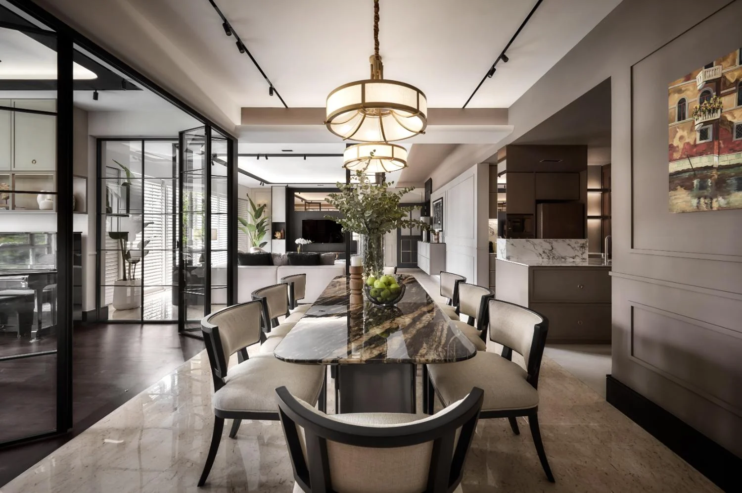 Dining area — rectangular table with rounded corners, upholstered chairs, pendant lighting and art on wall