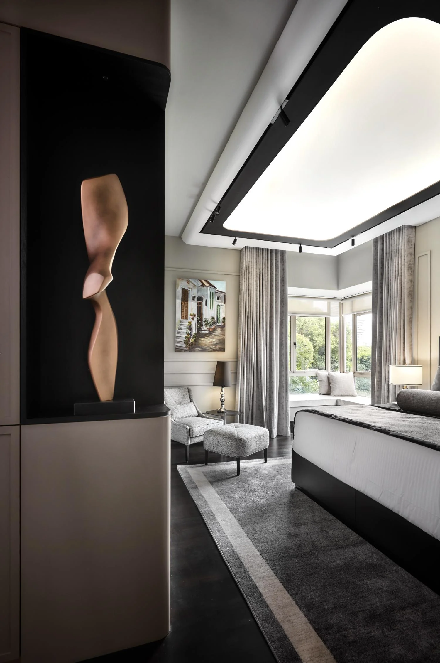 Master bedroom entrance — wainscoting panels, concealed lighting detail and sculptural door surround