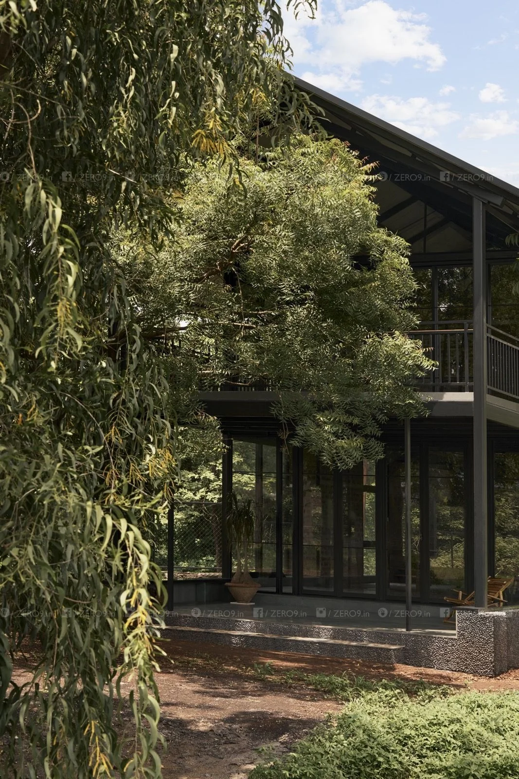 A sheltered verandah forms the transition between the house and its forested setting, the mature canopy providing shade and enclosure